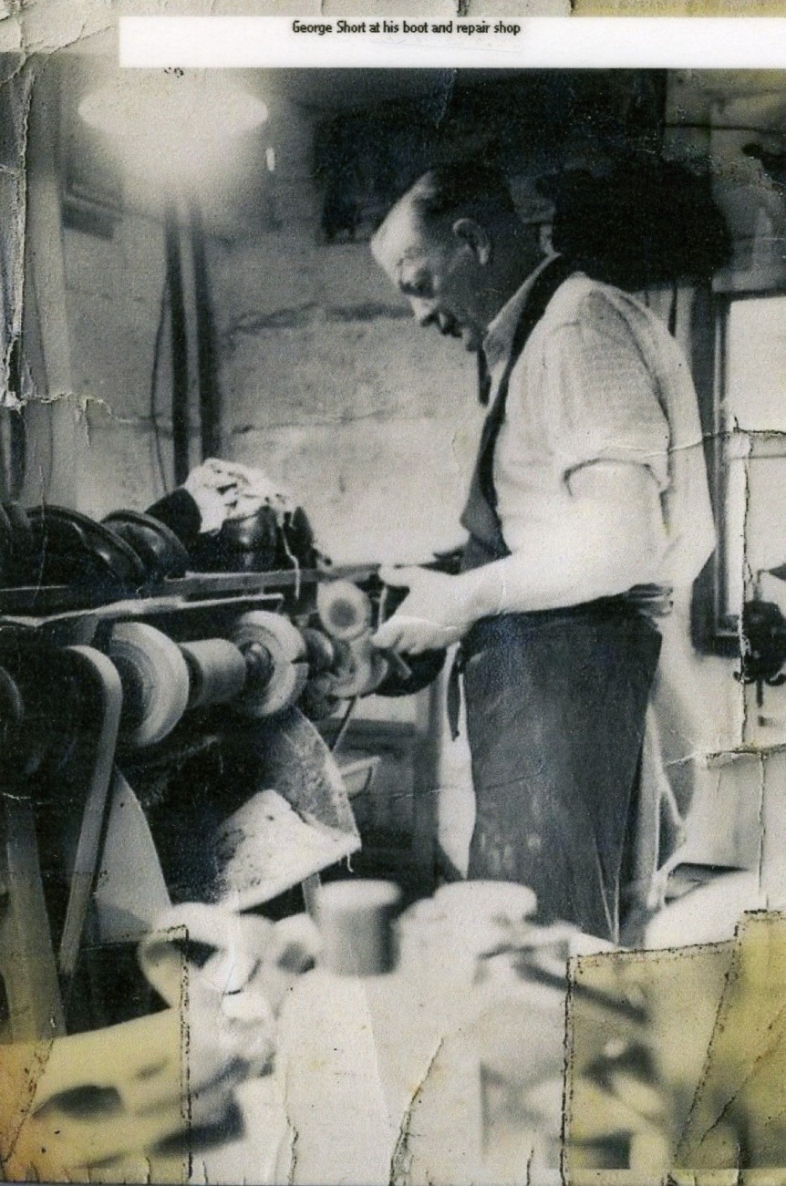 George Short in his boot and repair shop c.1950