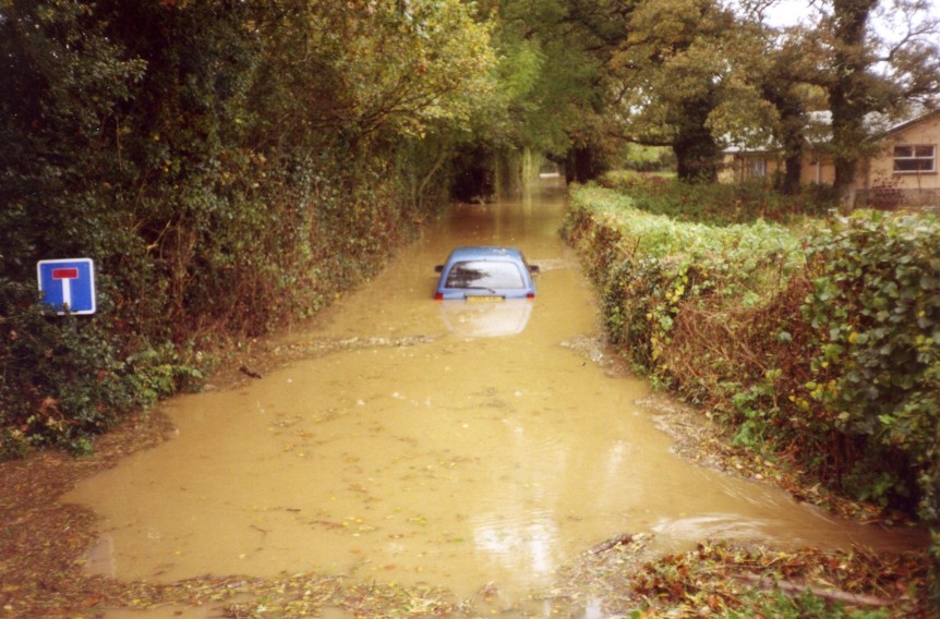 Sid Newcombe's car stuck in the flooded lane that leads to the kennels c. 2005